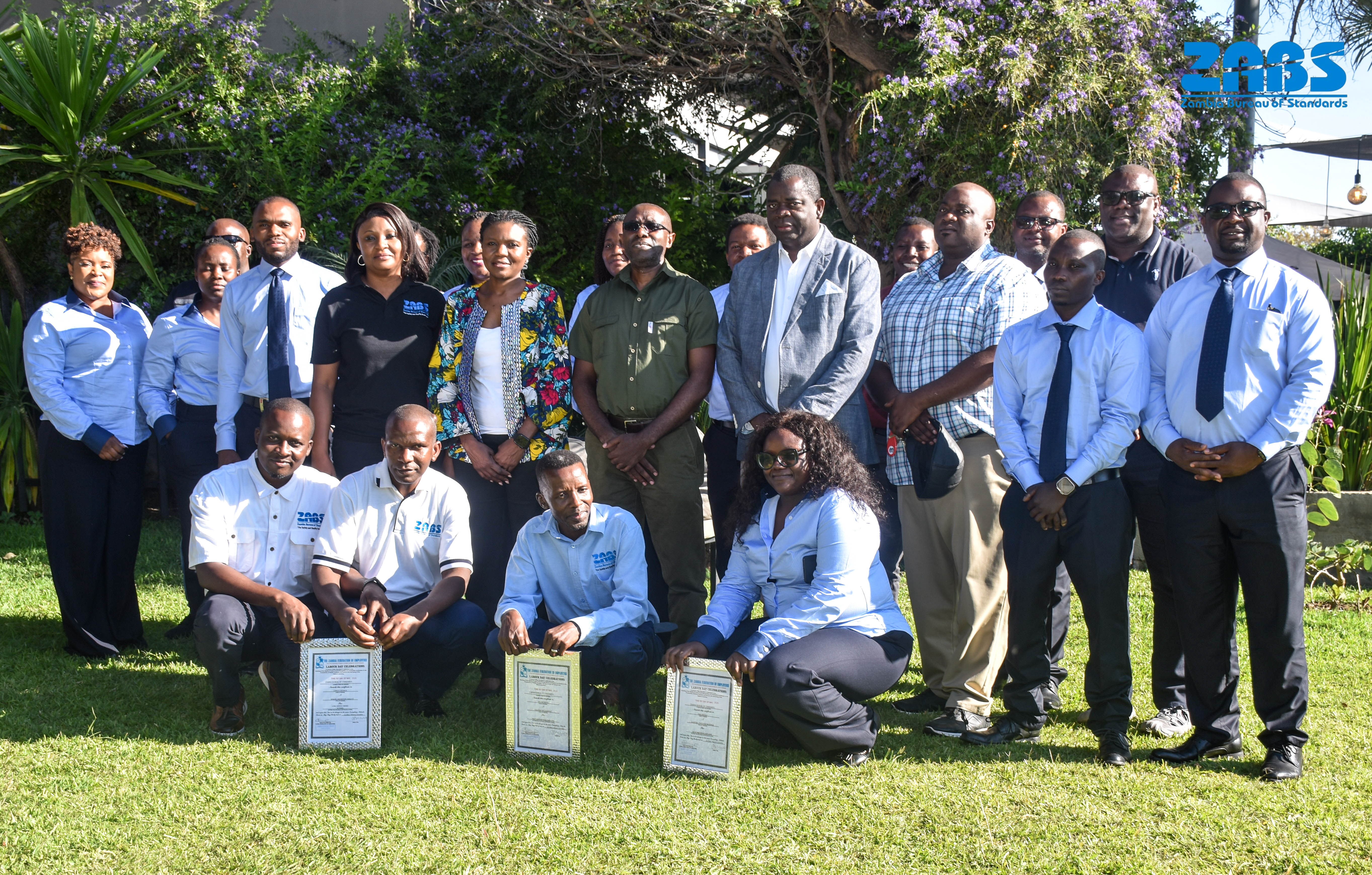 ZABS staff gathered outdoors during a Labour Day institutional event.