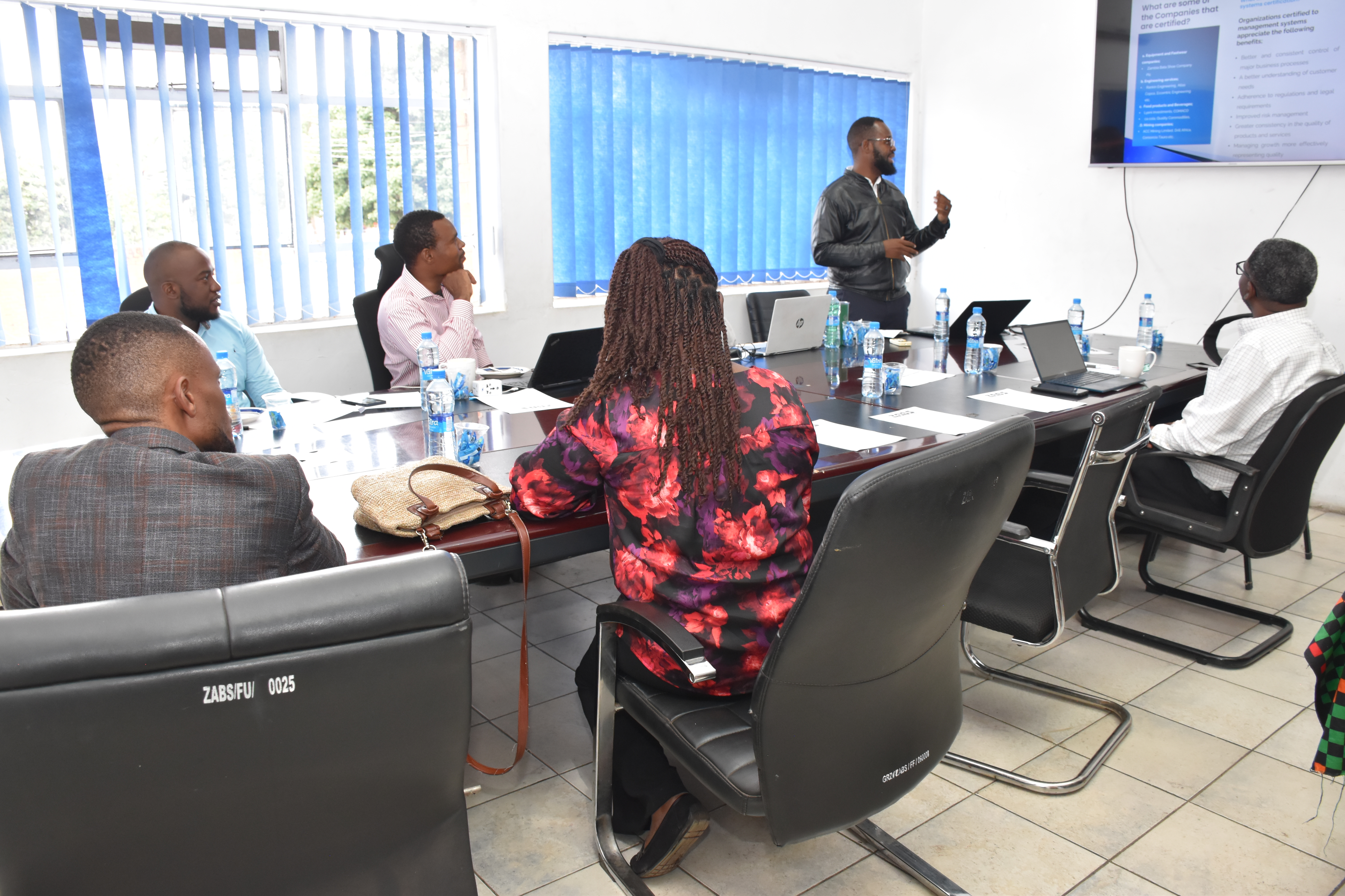 Technical standards development meeting in progress inside a boardroom.